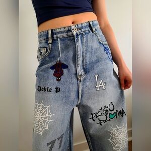 Hand painted trendy pants. Inspired by musician Peso Pluma.